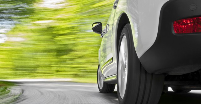 White car driving on road. Photo ID 26141697 © Supergenijalac | Dreamstime.com